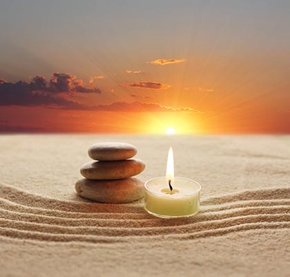 stones-candle-sand-ca109354969-web